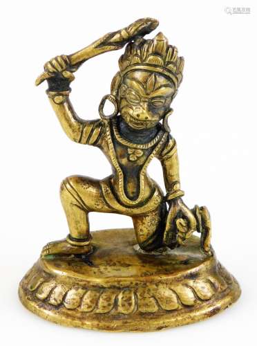 A Sino-Tibetan bronze figures of Manjushri, in mask holding a flaming sword in his right hand,