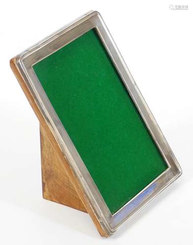 A George VI silver photograph frame, by Walker and Hall, of rounded rectangular outline with baize