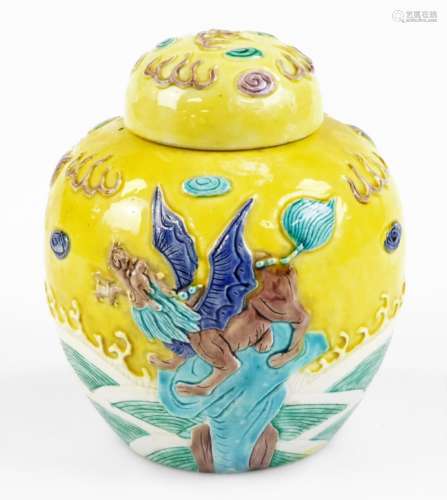 A Chinese porcelain ginger jar in the style of Wang Binrong, decorated in relief with a dogs of