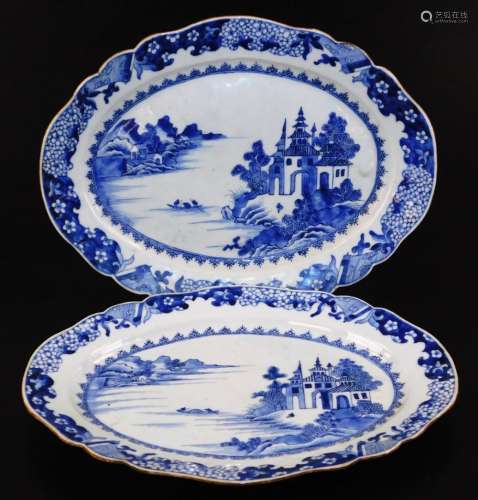 A pair of 18thC Chinese export porcelain meat plates, of shaped oval form, centred with figures in