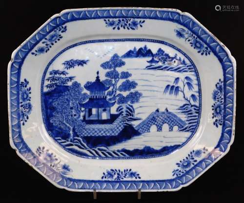 A Chinese export porcelain meat platter, of octagonal form, decorated with pagoda, figures on bridge