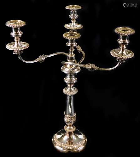 A Victorian electroplated candelabrum, with gadrooned sconces and bases and leaf formed baluster