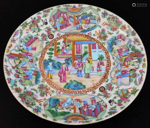 A Cantonese porcelain famille rose charger, of circular outline profusely decorated and centred with