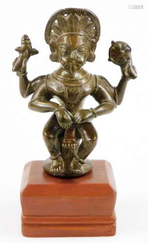 A late 18th/early 19thC South Indian Narasimha bronze figure of Vishnu, on a wooden plinth base,
