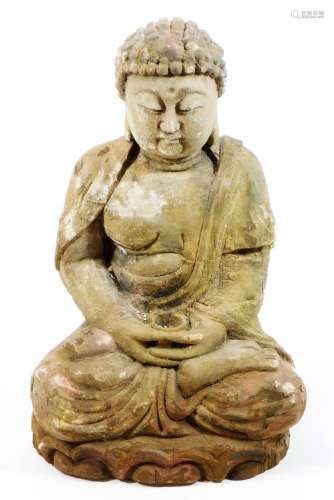 A carved wooden figure of Buddha in seated pose with legs crossed, holding a bowl, traces of paint