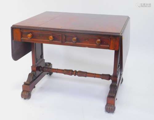 A William IV mahogany sofa table, with two frieze drawers, raised on square and fluted scroll