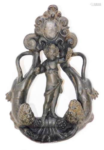 An early 17thC Venetian bronze door knocker, formed by a cartouche over a putti dividing two
