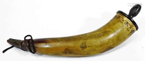An early 19thC scrimshaw cow horn powder flask, with turned wooden cap and screw filler cap, the