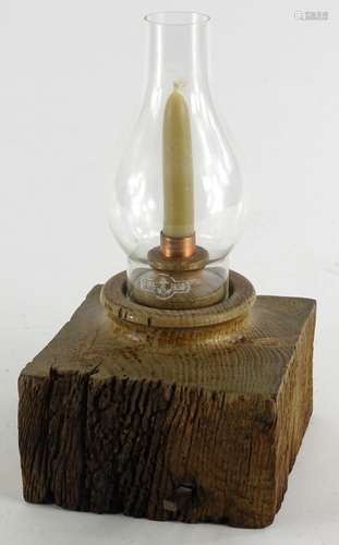 •Lincoln Cathedral treen oak candlestick, with glass shade, signed and titled verso, 29cm high.