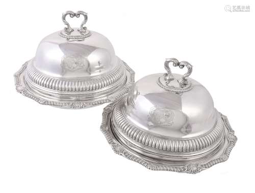 A pair of late George III silver shaped circular vegetable dishes and covers by William Stroud
