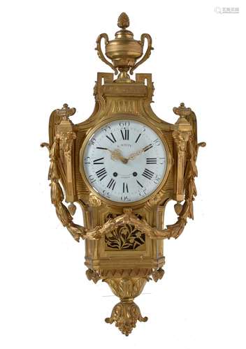 A Louis XVI style gilt brass cartel clock