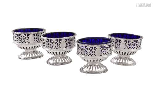 A set of four George IIII silver oval pedestal salt cellars by Robert Hennell I