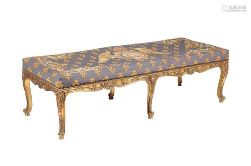 A carved and gilded long stool in the George II style