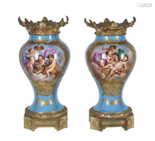 A pair of French porcelain Sevres style gilt-metal mounted inverted baluster vases