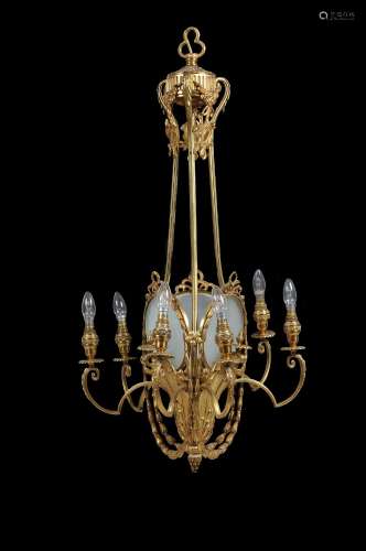 A Belle Epoque gilt metal and frosted glass seven light chandelier