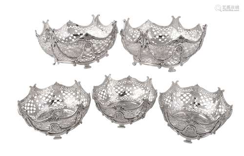 A suite of five Victorian silver shaped circular dessert baskets by Robert Harper