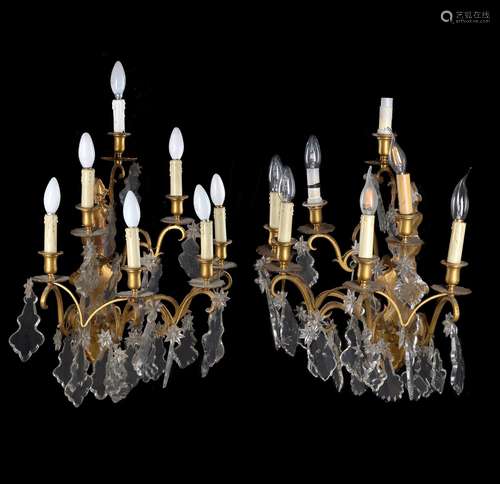 A pair of gilt metal and cut glass six branch wall appliques in Louis XV style