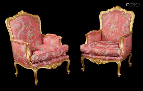 A pair of French giltwood bergeres armchairs in Louis XV style