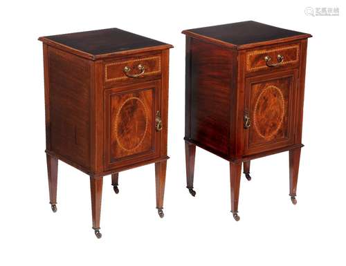 A pair of Edwardian mahogany bedside cupboards