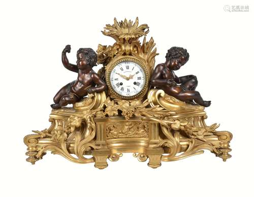 A late 19th century French ormolu and patinated bronze clock in the Louis XV style