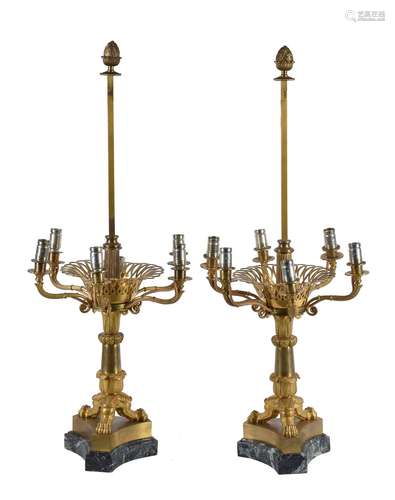 A pair of Restauration gilt metal and verde antico mounted six light candelabra