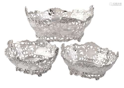 A matched suite of three Edwardian silver oval dessert baskets