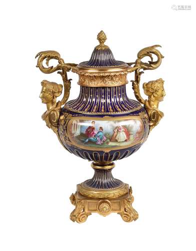 A French porcelain and gilt metal mounted urn and cover in Sevres style