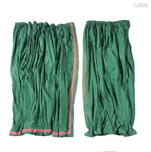 A pair of dark green silk curtains