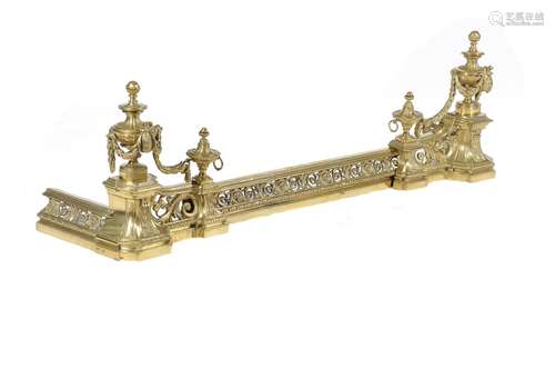 A brass fire fender in Louis XVI style