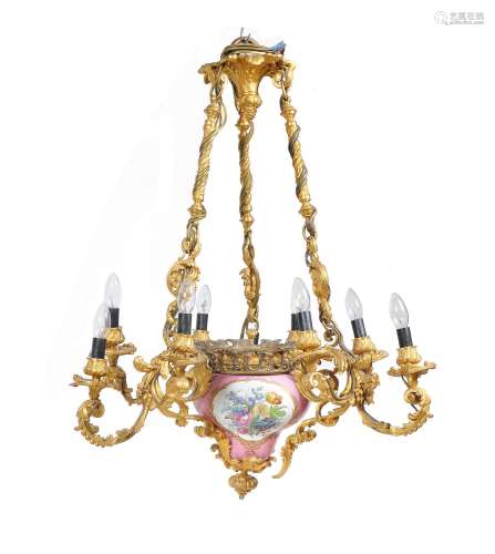 A Napoleon III gilt bronze and Sevres-style porcelain nine light chandelier