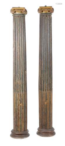 A pair of painted oak columns in the Ionic order