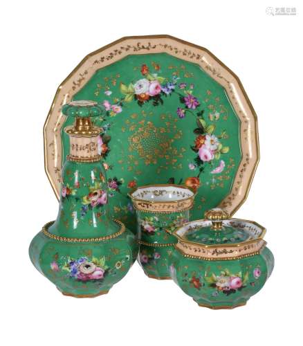 A French porcelain green-ground and gilt solitaire absinthe service painted with flowers
