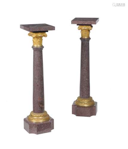 A pair of French porphyry and gilt bronze mounted pedestal columns