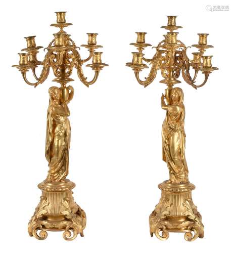A pair of Napoleon III ormolu nine light figural candelabra