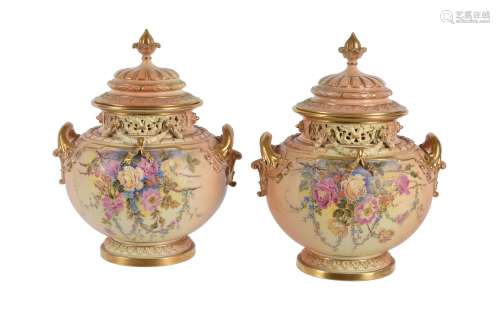 A pair of Royal Worcester ivory-ground pot-pourri urns and covers signed and painted with flowers by