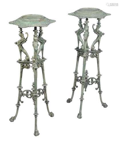 A pair of French cast iron and green enamel low torcheres in early 19th Century style