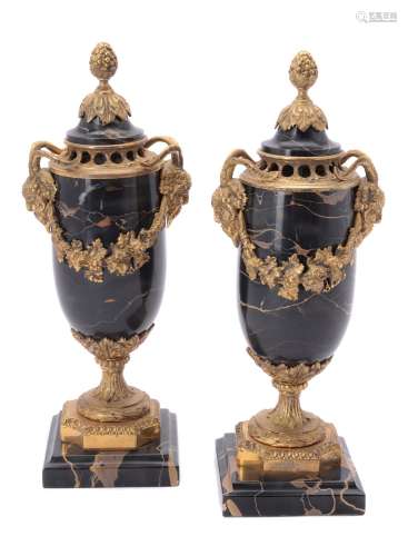 A pair of French flecked black marble and gilt metal mounted vases