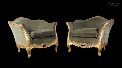 A pair of carved giltwood tub chairs