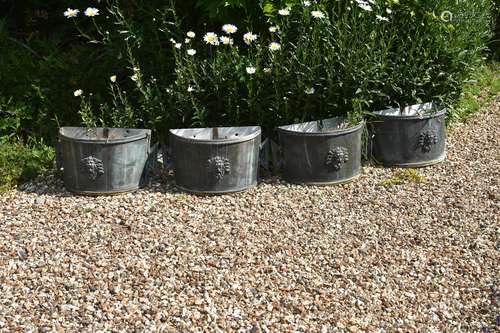 A set of four painted metal planters in 18th Century style