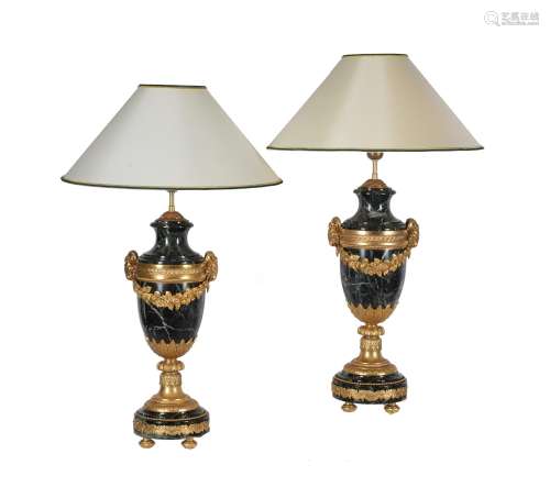 A pair of French green serpentine marble and gilt metal mounted table lamps in Louis XVI style