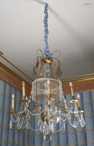 A Continental gilt metal and cut and moulded glass eight light chandelier