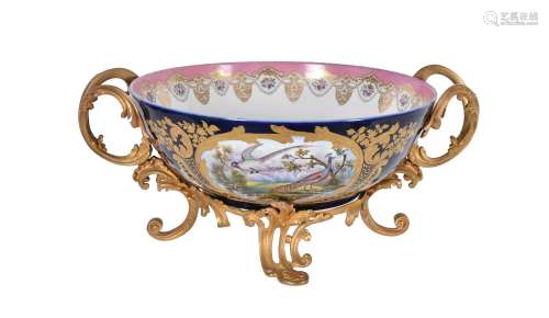 A French porcelain and gilt metal mounted twin-handled bowl