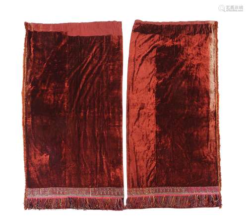 A pair of orange red velvet curtains