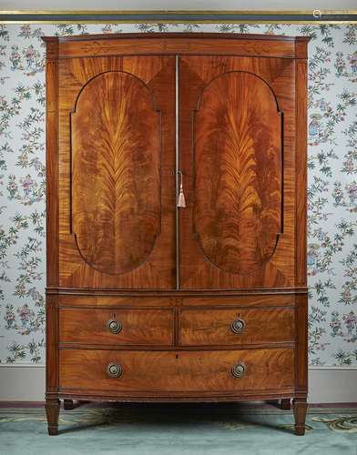 A Regency mahogany and inlaid linen press