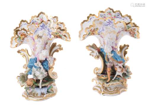 A pair of French biscuit and glazed porcelain figural frill vases