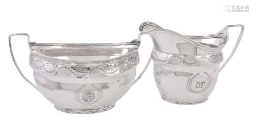 A George III silver oval sugar basin and cream jug