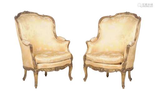 A pair of gilt framed fauteuils in the Louis XVI style