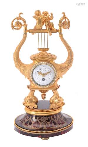 A French gilt metal and tortoiseshell timepiece in early 19th century style