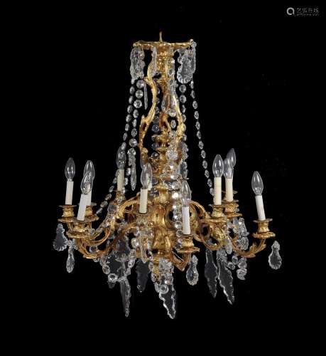 A French gilt metal and cut glass twelve light chandelier in Louis XVI style