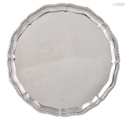 A silver shaped circular salver by Carrington & Co.